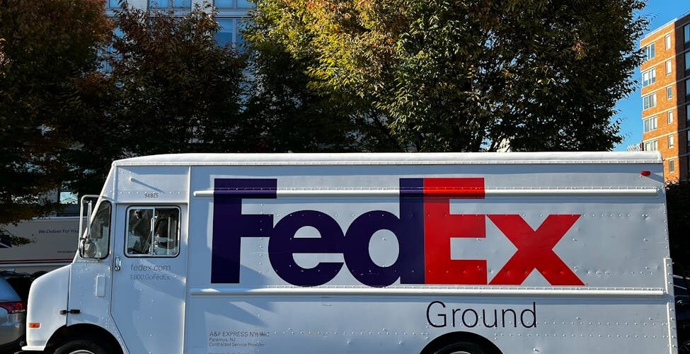 parked fedex van on the asphalt road